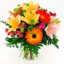 Ramo de Flores Mediano En tonos Naranja con Liliums Gerberas y Mix de Flores